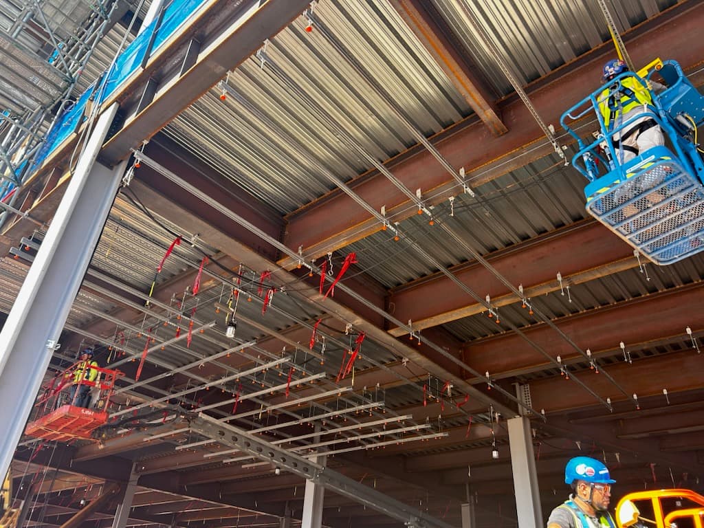 MagGuard installed across overhead threaded rods on job site